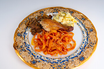 Traditional Brazilian Sunday lunch, pasta, roast chicken and mayonnaise salad with potatoes