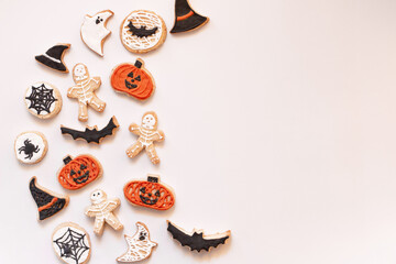 Halloween gingerbread cookies on white background. Bright homemade cookies for Halloween party