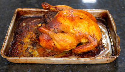 Rustic roast chicken stuffed with farofa