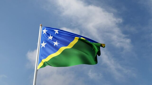 Flag of the Solomon island on a blue sky, flag on a flag pole waving in the wind, oceania country, national symbol of the solomon island, video of a flag