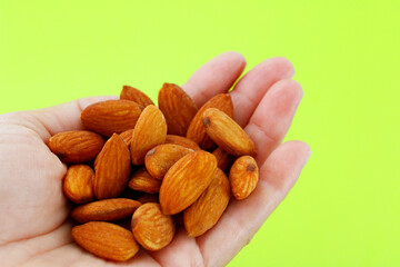 Holding a handful of tasty almonds