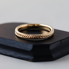 Wedding rings on a black book on a white background.