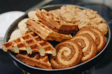Colorful display of pastries topped with fruits. Shallow depth of field