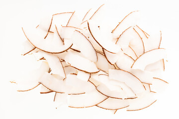 Pile of dehydrated coconut flakes with sugar - Cocos nucifera.