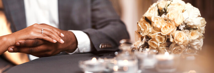 Magic moment, love story. Black couple in love getting engaged in restaurant, close up, panorama