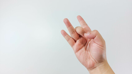 Hand gesture close up, ready to flick, akash sunya mudra. Isolated on white background