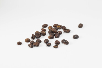 A small amount of fresh roasted robusta and arabica coffee beans, isolated on white background