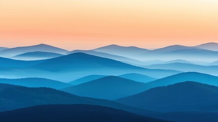 Obraz premium A mountain range viewed from a hilltop during sunset