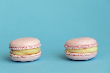 fleet of delicious almond macaroons on plain background, delicate dessert