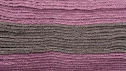 A purple and gray striped fabric. The stripes are of different colors and the fabric is very soft
