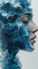 Surreal portrait of a woman with ocean waves and water splashes blending with her profile