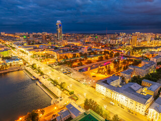 Fototapeta premium Embankment of the central pond and Plotinka in Yekaterinburg at summer or early autumn night. The historic center of the city of Yekaterinburg, Russia, Aerial View