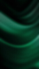 Obraz premium A smooth, vertical abstract gradient with deep green, black, and teal waves blending softly. This grainy texture is ideal for 4K backgrounds, wallpapers, and banners