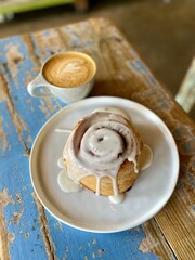 cinnamon roll and a hot coffee 