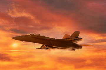 A military jet flies through burnt cloudy skies with the sun in the background
