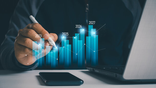 Yearly financial report, chart with years data statistics, company progress and growth by year. Businessman analyzes profitability of working companies with digital augmented reality graphics. 2025.