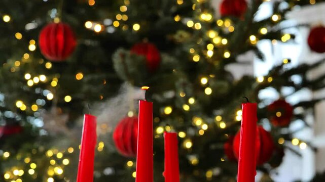 Advent wreath.fourth Advent ends.Christmas begins.Smoke from red candles in a Christmas advent wreath.Christmas traditions and customs. 4k footage