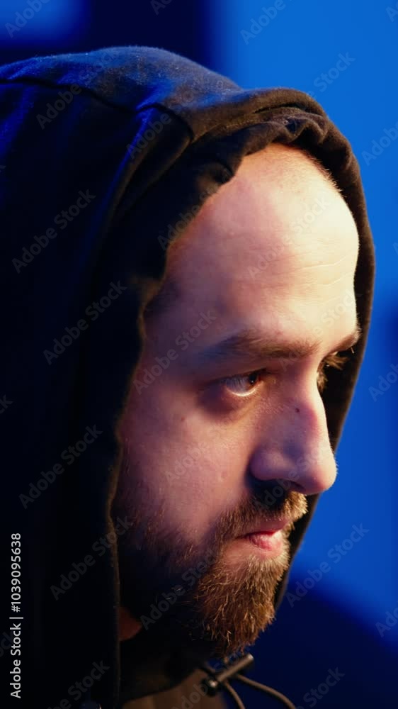 Aufkleber vertical video hooded hacker targeting vulnerable unpatched connections, seeking to compromise digit