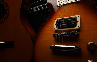 Fototapeta premium close-up photo of an electric and acoustic guitar for a musical banner background with musical instruments with free space