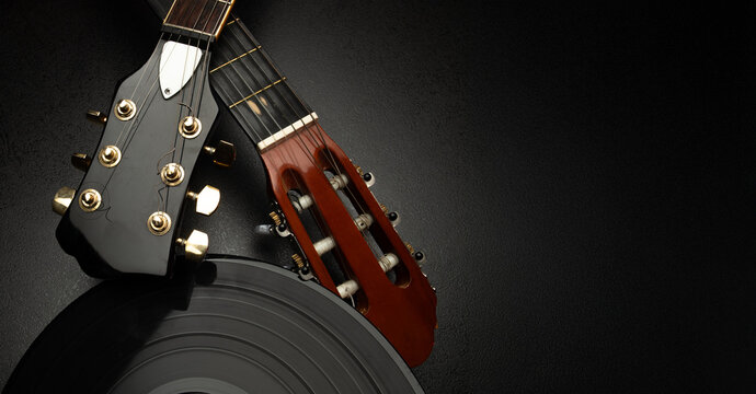 music background banner with vinyl and instruments. close-up of vinyl record with musical equipment instruments for music banner background postcard poster with free space for text