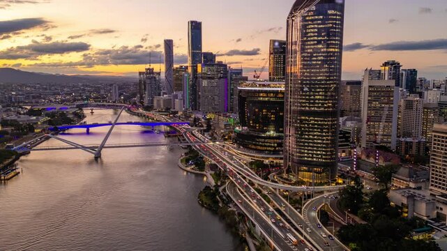 Aerial hyperlapse, dronelapse video of Brisbane city in Australia from sunset to night