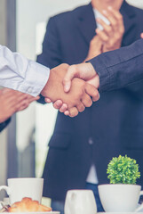 Vertical Businessman shaking hands together team partnership teamwork. Trust honesty business...