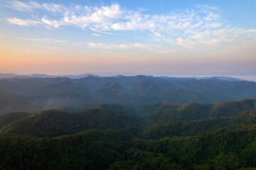 Naklejka premium Beautiful aerial view of green forest and nature rainy season.