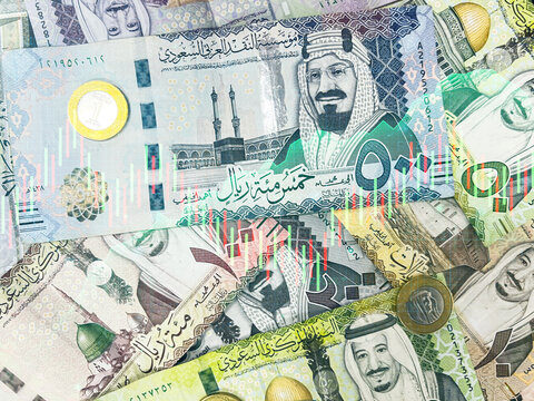 Trading and business in Saudi Riyal financial concept background with papers. Business and investment backdrop with the currency of Saudi Arabia