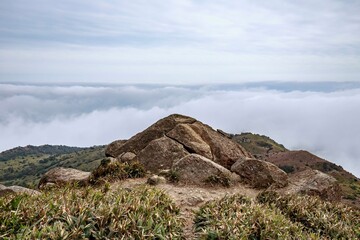 Rocky Mountain Peak Rising Above the Clouds with Scenic View