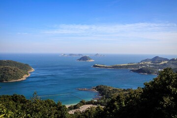 Fototapeta premium Aerial View of Coastline and Islands Surrounded by Blue Sea