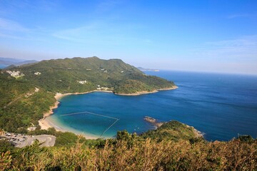 Fototapeta premium Aerial View of Coastline and Islands Surrounded by Blue Sea