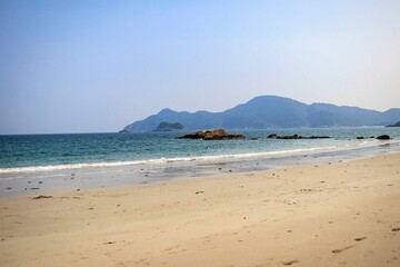 Serene Beach with Mountainous Backdrop and Clear Blue Sky, Sai Kung, Hong Kong