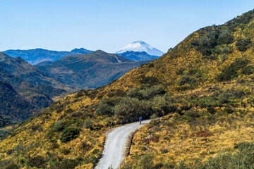 Lonely man walking in the mountains