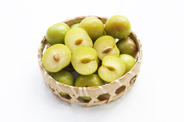 Fresh green plum fruit on white background.