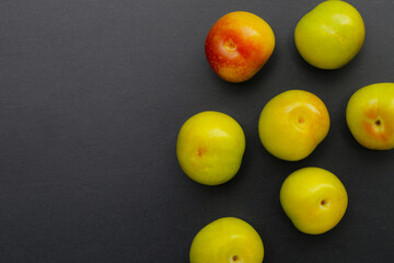 Fresh green plum fruit on white background.
