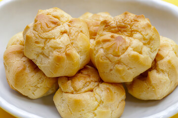Cream puffs on white background