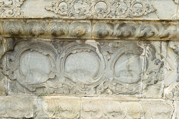 Vintage ornament on the stone. Close-up seamless texture. Stone texture. Embossed pattern.