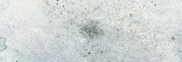 Close-up of an old grey concrete wall with a rough, weathered texture. Classic retro texture for poster banner background and other digital needs.