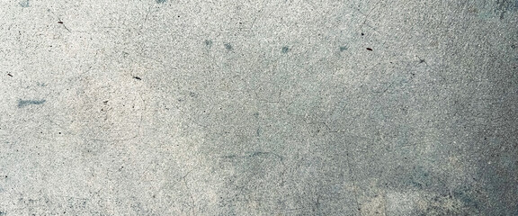 Close-up image capturing the detailed texture of a weathered concrete surface. Classic retro texture for poster banner background and other digital needs.