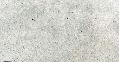 Weathered grey concrete surface with thin cracks and red streaks. Classic retro texture for poster banner background and other digital needs.
