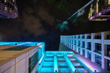 Neon lights in the city looking up