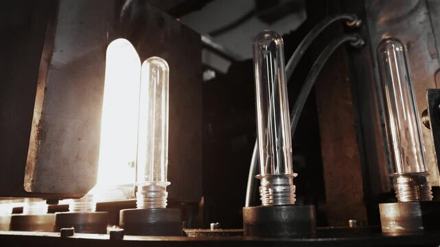 PET preform heating stage in bottle blow molding machine before inflation.