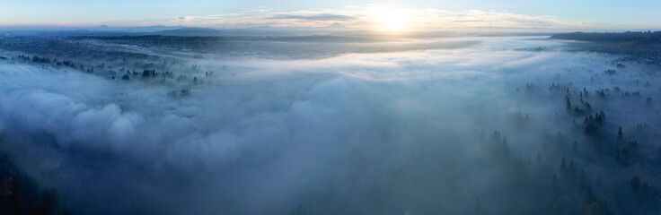 Early morning fog drifts through the Willamette Valley in West Linn, Oregon. This scenic area lies just south of the Pacific Northwest city of Portland.