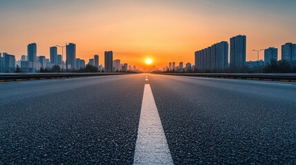 empty highway with city skyline at sunrise