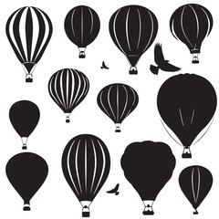 A set of vector silhouettes of hot air balloons , black silhouettes isolated on white background