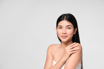 Beautiful young asian woman with clean fresh skin on face. Girl facial treatment. Cosmetology, beauty and spa.