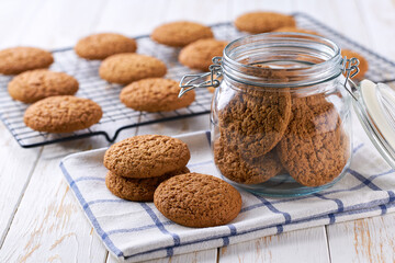 Oatmeal cookies on a white table, selective focus.