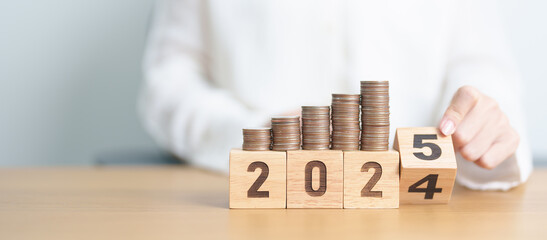 2024 end year to Happy New Year 2025 with Coins stack. Money, Budget, tax, investment, financial,...
