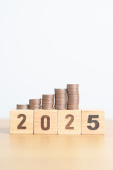 Happy New Year 2025 with Coins stack. Money, Budget, tax, investment, financial, savings and New Year Resolution concepts