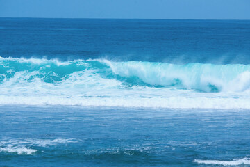 Beautiful waves of Melasti Beach ocean located in Bali